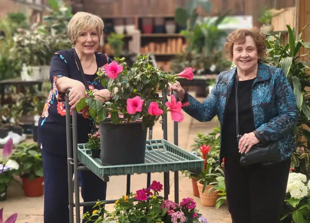 Two women with flowers