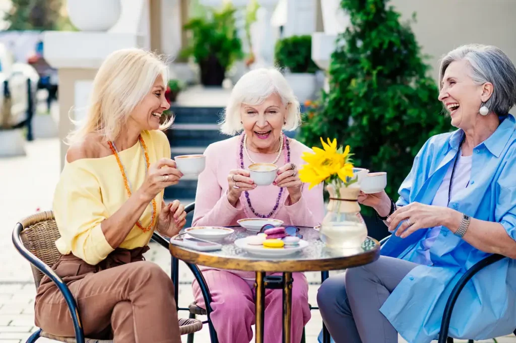 Three women enjoy tea outdoors